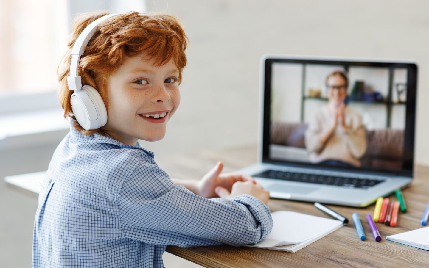 Cheerful boy during online lesson at home